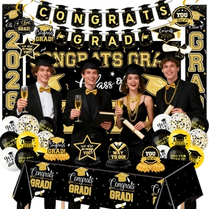 Detailed black and gold 2026 graduation party set with banner, balloons, and tablecloth