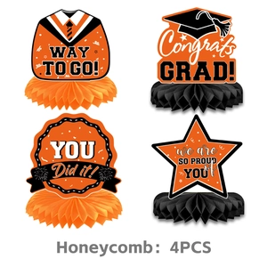 Set of four graduation honeycomb centerpieces in orange and black with congrats grad text