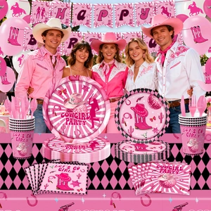 Pink cowgirl birthday party supplies set with paper plates, cups and themed decorations