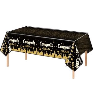Detail of waterproof black and gold Congrats Grad tablecloth for graduation parties