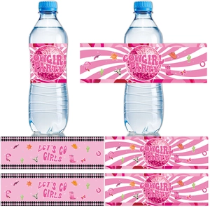 Macro view of pink cowgirl party water bottle labels featuring disco ball and boot designs