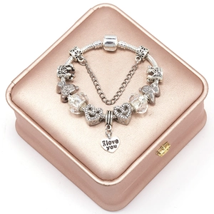 Silver bead charm bracelet with crown and heart pendant engraved with I love you