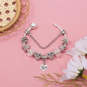 Silver charm bracelet with I Love You heart pendant and pumpkin carriage beads