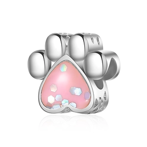 Detail of silver cat paw charm with pink heart inlay and hollowed-out side patterns