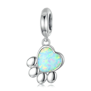 Macro detail of S925 sterling silver cat paw pendant with heart-shaped opal stone