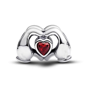 Silver hand holding red heart crystal charm for DIY bracelets with polished finish