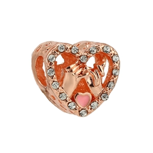 Macro detail of rose gold heart charm featuring pinky swear gesture and pink enamel heart