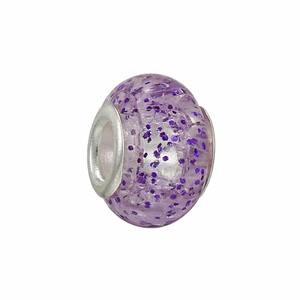 Macro detail of a translucent purple DIY crystal bead with embedded glitter and silver core