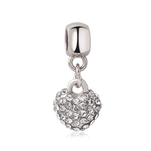 Macro detail of silver heart charm bead with sparkling pavé cubic zirconia inlay