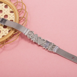 Silver mesh band bracelet with heart and family charms on a pink background