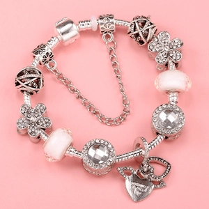 Silver snake chain bracelet with pink glass beads and sparkling heart pendants