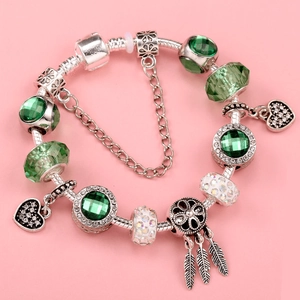 Silver snake chain bracelet with green crystal beads and heart dreamcatcher charms