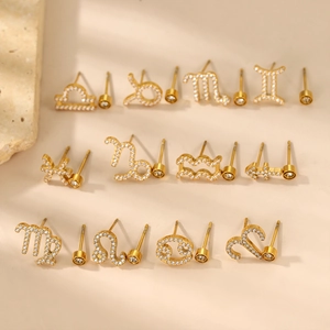 Coffret de 12 paires de boucles d'oreilles zodiaque dorées avec zircons étincelants
