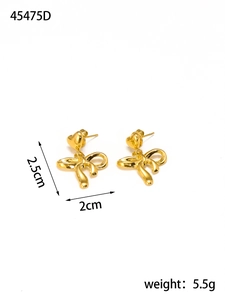 Detailed view of gold bow earrings with heart studs showing 2.5cm height and 2cm width