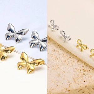 Bowknot and butterfly stud earrings in gold and silver finish with polished metal texture