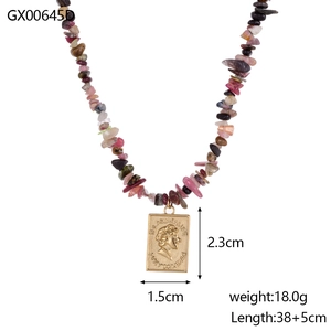 Macro view of multi-color natural stone chain and vintage gold relief pendant necklace