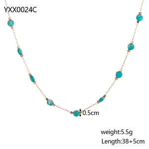 Detail of beaded necklace with blue natural stones, gold cubes and adjustable extender chain