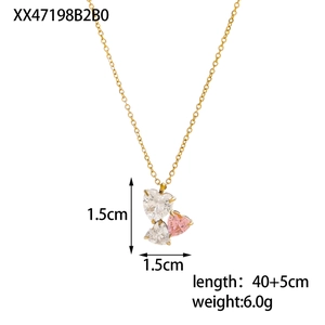 Detail of gold heart pendant with zircon stones showing chain length and dimensions