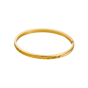 Detail showing the hinged clasp and textured leaf pattern on golden stainless steel bracelet