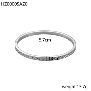 Detail view showing 5.7cm diameter and diamond cut texture on silver steel bangle