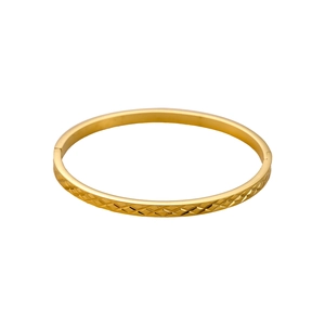 Detailed view of golden stainless steel bracelet featuring diamond cut pattern and clasp