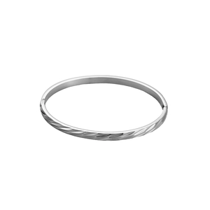 Detailed macro view of irregular texture on silver titanium steel bangle with hinge
