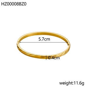 Vintage irregular titanium steel bangle with gold wheat pattern and 5.7cm diameter