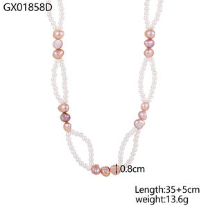 Detailed view of layered necklace with pink baroque pearls and white freshwater pearls