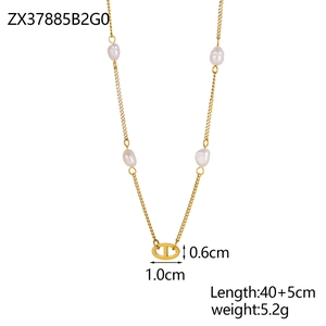 Detail of gold necklace with baroque pearls and oval link pendant 40+5cm length