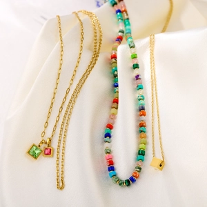 Colorful vintage stacked necklace set with gemstone pendants and bohemian beaded chain