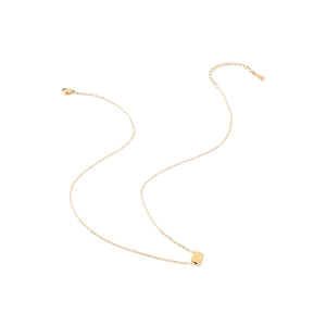 Detail of gold necklace featuring a small polished cube pendant and secure lobster clasp