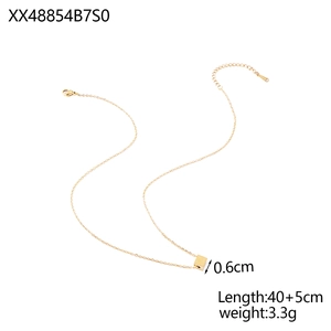 Detail of gold cube pendant necklace with lobster clasp and adjustable link chain