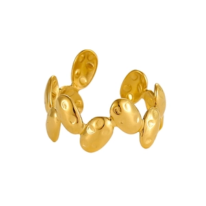 Close-up of gold-plated stainless steel ring with irregular bean texture and open design