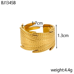 Detailed view of golden feather ring with dimensions of 1.7cm diameter and 1.3cm width