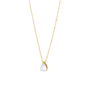Close-up of golden teardrop pendant necklace with a clear pear-cut sparkling zircon
