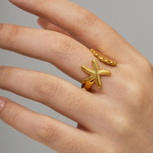 Elegant 18k gold ocean starfish shell open ring featuring a textured starfish design
