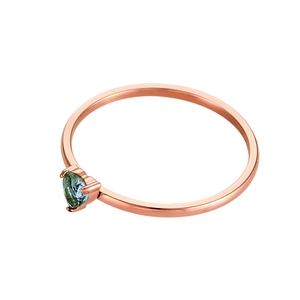 Close-up of heart-cut teal gemstone on thin rose gold stainless steel ring band