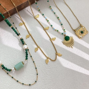 Bohemian multilayer gold necklaces set with green natural stone and evil eye pendants