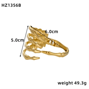 Unique gold skeleton hand cuff bracelet with realistic bone texture and open design