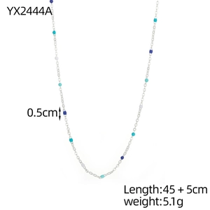 Detailed view of silver bead chain necklace with colorful enamel charms in 0.5cm diameter