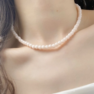 Elegant french vintage beaded necklace featuring soft pink pearls for a chic style
