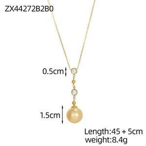 Detail of long gold necklace with 1.5cm pearl and crystals with scale measurement lines