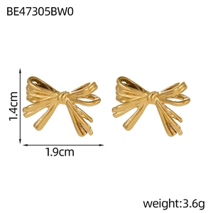 Detail showing 1.4cm by 1.9cm golden bow earrings with size and weight measurements