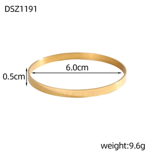 Detail of gold bangle with Love without end hath no end engraving showing 6.0cm diameter