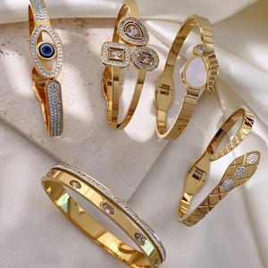 Elegant gold-plated evil eye and snake-shaped spring bracelets with CZ inlay for women