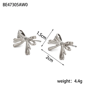 Detail of silver bow earrings showing size 2cm x 1.5cm and metallic ribbon texture