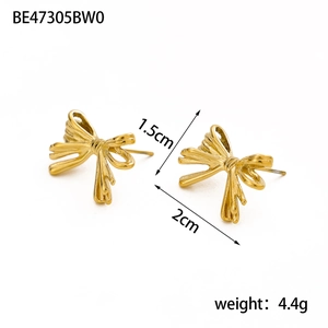 Detailed view of golden bow stud earrings showing dimensions 1.5cm by 2cm and weight