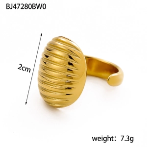 Detailed view of 2cm oval gold ring with horizontal textured grooves and polished finish