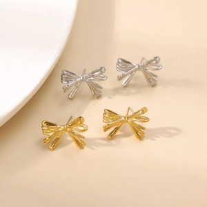 Minimalist bow-knot stud earrings in gold and silver finish with hollow metal wire texture