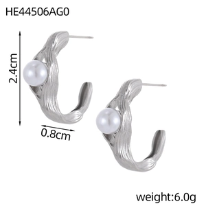 Detail view of silver C-shaped pearl earrings with 2.4cm height and ripple texture